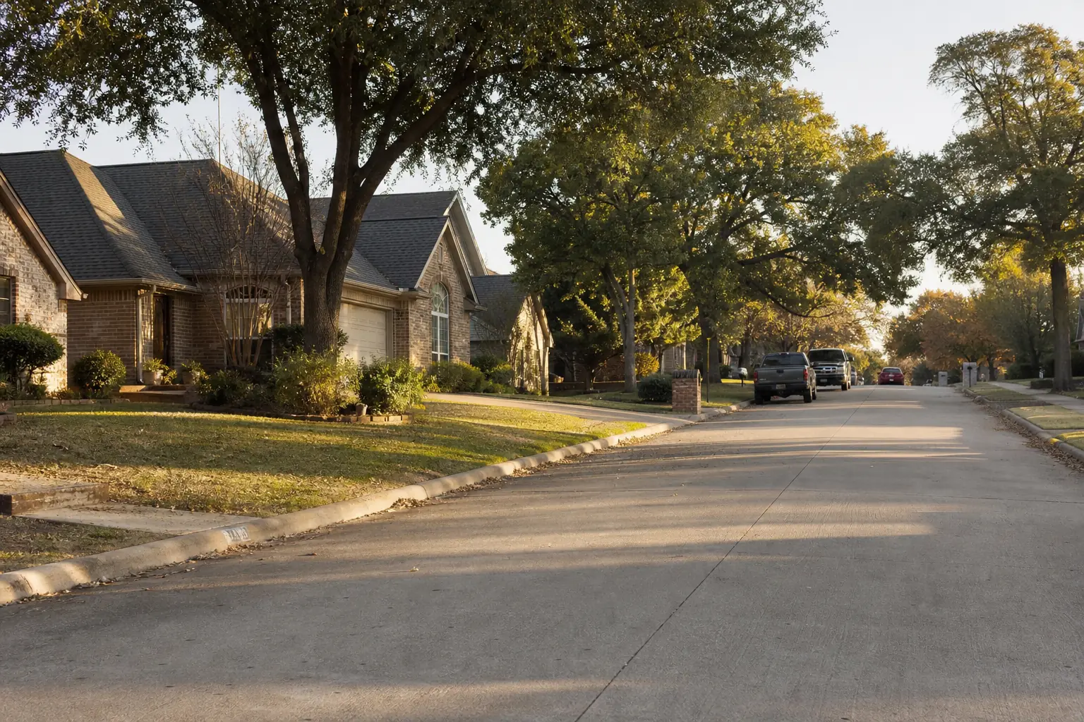 Tree-lined residential street in a Dallas neighborhood